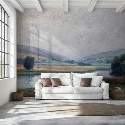 White sofa with brown cushions in a room with a large landscape wall mural
