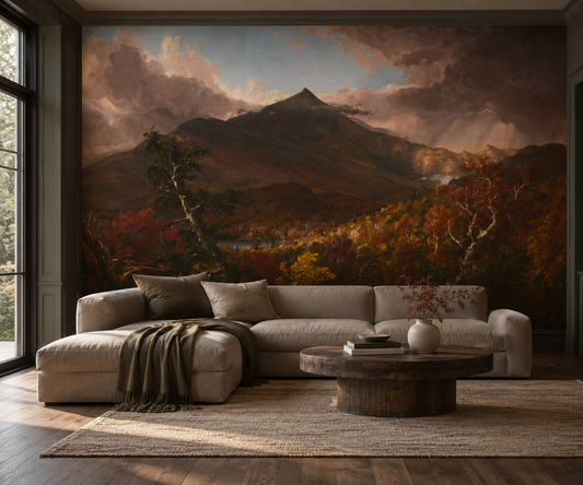 Moody mountain landscape mural with dramatic pink storm clouds, dark mountain peaks and richly coloured autumn forests in moody living room.