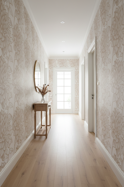 Beige and cream botanical wallpaper with oversized hand-drawn leaves and floral foliage in a soft neutral colour palette in hallway