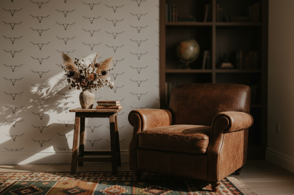 Western longhorn wallpaper featuring minimalist hand-drawn cattle skulls on a warm cream background, creating a modern ranch, western farmhouse, and rustic cowboy aesthetic for entryways, bedrooms, and living spaces, in living room