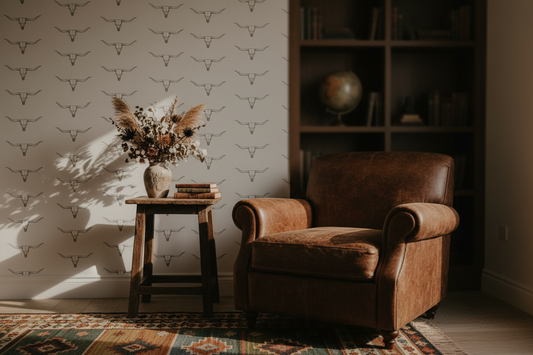 Western longhorn wallpaper featuring minimalist hand-drawn cattle skulls on a warm cream background, creating a modern ranch, western farmhouse, and rustic cowboy aesthetic for entryways, bedrooms, and living spaces, in living room